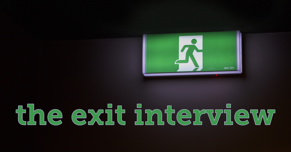 A dark image with a green emergency exit sign showing a running figure, with large green text below reading 